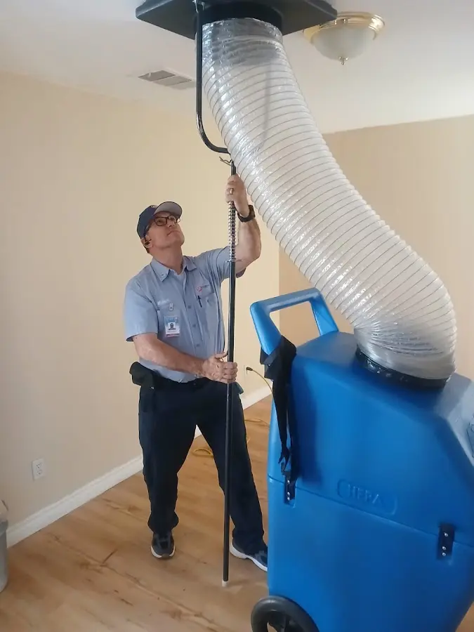 Furnace Tune-Up technician using HEPA equipment in Fremont